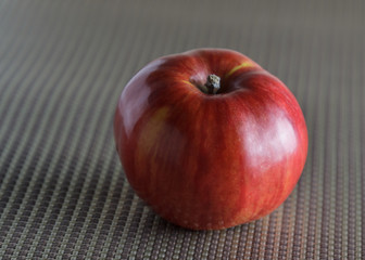 Red Apple on grey material