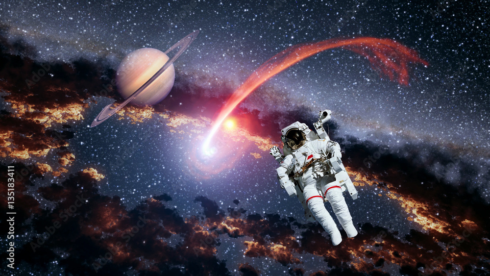 Wall mural astronaut planet saturn spaceman comet outer space suit galaxy universe. elements of this image furn