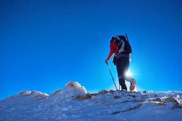 Woman hiking in winter Tatra mountain