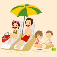 Cute family on beach sunbathing relaxing and playing on vacation