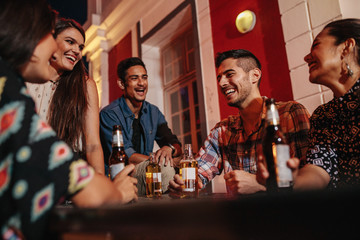 Young people on rooftop with drinks