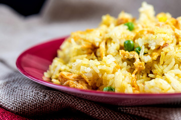 Homemade Chinese fried rice with vegetables and fried eggs