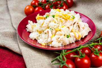 Homemade Chinese fried rice with vegetables and fried eggs