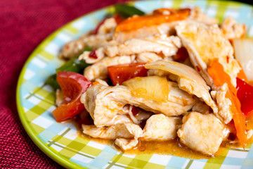 wok fried chicken stir fry with sweet peppers and chinese vegeta