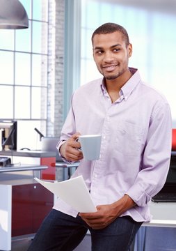Happy casual afro american businessman at office
