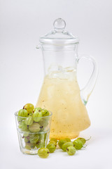 glass decanter with gooseberry juice and ice