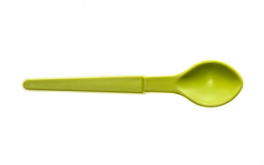 Close-up of a plastic tableware spoon for babies and children.
