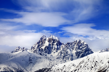 Snow mountains and blue sky with clouds in winter