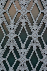 Fragment of the iron door with a pattern