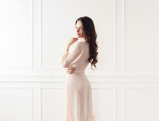 Naklejka premium Fashion shoot of beautiful woman in dressing gown. Fashion, vogue, glamour concept.
