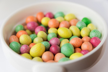 Many colorful jelly beans in a sweet glaze