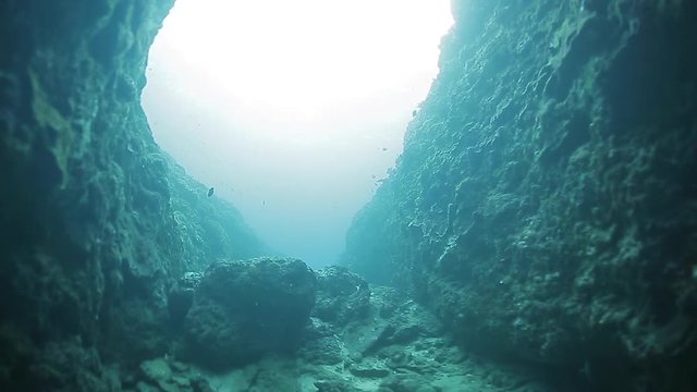 Underwater footage of exiting from the narrow canyon. High level of noise, iso 800