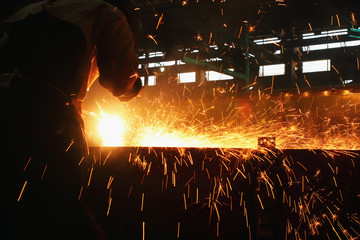 Sparks and smoke from Gouging carbon in industrial