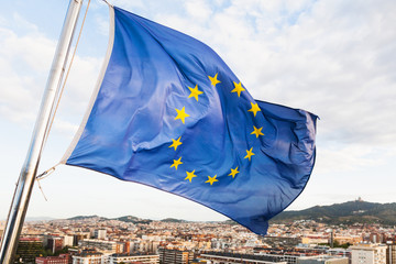 EU flag flutters above Barcelona city