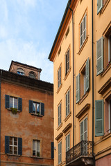facades of old urban houses in Modena city