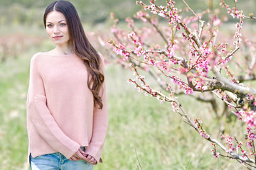 Beautiful woman in a spring garden 