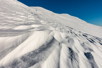 Contrast between snow and blue sky