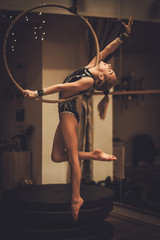 Plastic little girl gymnast on acrobatic ring
