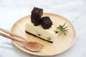 Brownie cheese cake on wood plate