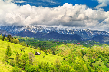 Fototapeta na wymiar Spring landscape with snowy mountains near Brasov, Transylvania, Romania, Europe
