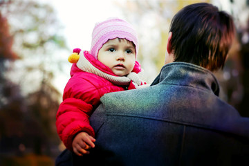Fototapeta premium Cute little girl walks in the park