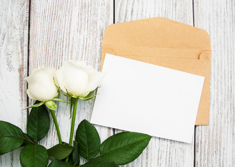 White roses and envelope