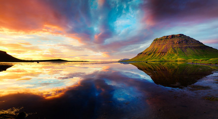 Colorful summer sunset with Kirkjufell Mountain in Grundarfjordu