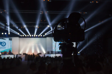 Silhouette of cameras in concert. 