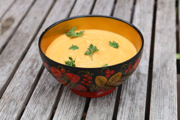 Pumpkin soup in Russian folk art khokhloma bow