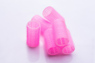Hair curlers on white background