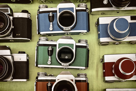 Retro styled image of photo cameras on a flee market