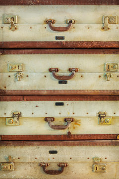 Pile of antique weathered suitcases