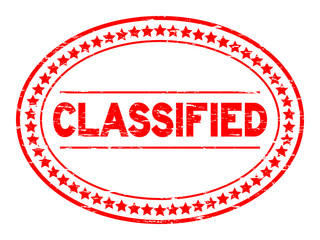 Grunge red classified oval rubber stamp on white background