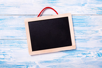 Frame on blue wooden background