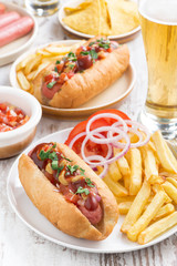 fast food - hot dog with French fries, beer and snacks 