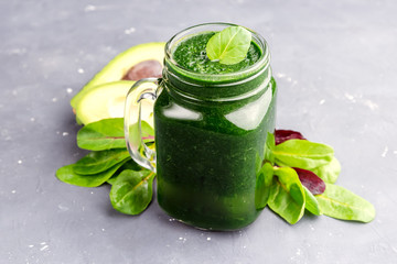 Green smoothie in a jar mug Healthy food and detox.
