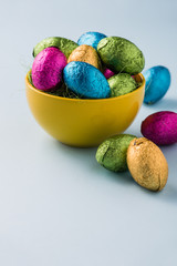 Colourful easter eggs in metallic wrapping