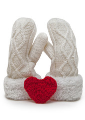 Soft couple. Knitted mittens with red heart, isolated on a white background.