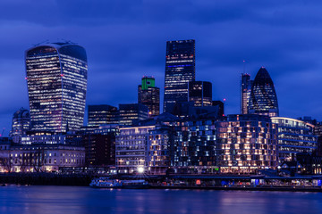 City of London buildings at dusk on the River Thames