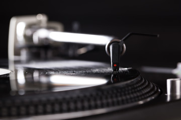 DJ headshell on spinning record