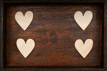 Hearts on vintage wooden background. Free place. Background for your design