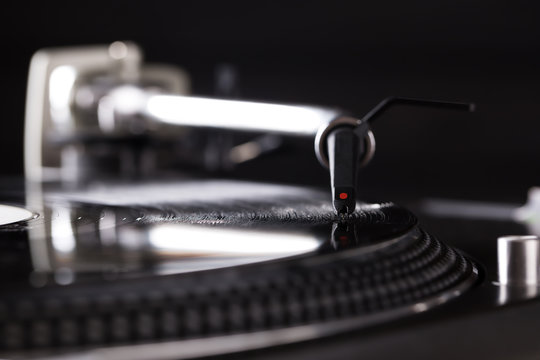 DJ headshell on spinning record
