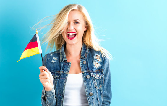 Young woman holding German flag