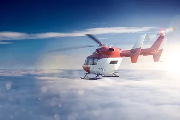 Zelfklevend Fotobehang Helikopter boven de wolken © VanHope
