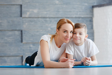 Young boy kissing her mum