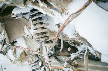 accident car in snow. twisted metal parts affected by a frontal collision