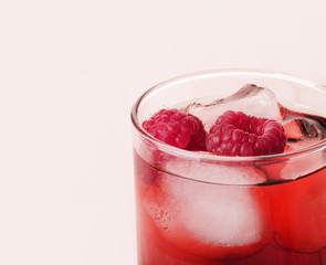 Red raspberry drink with ice cube