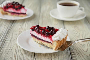 Cake dessert with cream, currants, cherries and coffee