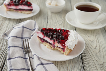 Cake dessert with cream, currants, cherries and coffee