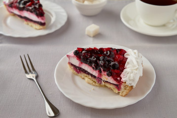 Cake dessert with cream, currants, cherries and coffee